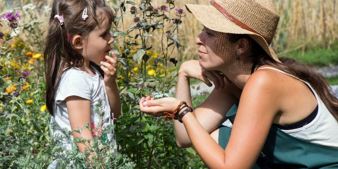 A child eating berries from the garden 